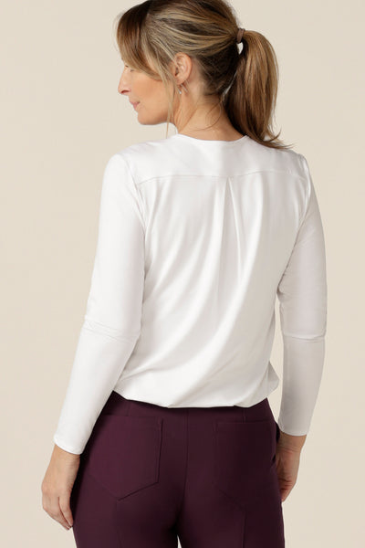 Back view of the Dakota Top in White Bamboo - a great top for work or casual wear, this long sleeve, V-neck top in white bamboo jersey is a clothing essential that will match with your capsule wardrobes. Made in Australia by Australian and New Zealand women's clothing brand, L&F.