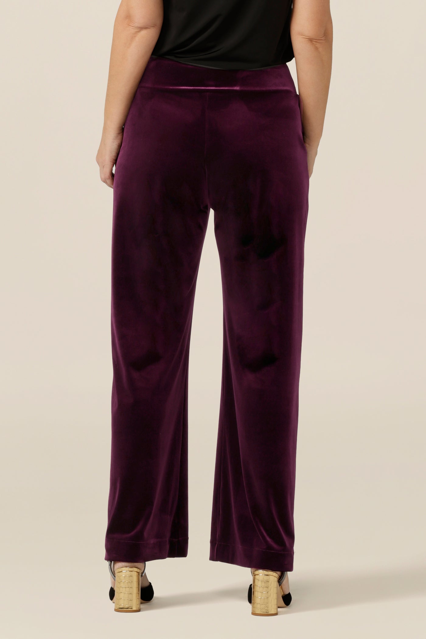 Slinky eveningwear pants make a good alternative for cocktail dress and occasionwear. Made in Australia by Australian and New Zealand women's clothing label, L&F, these straight-cut, wide leg pants in stretchy velour wear well with formal jackets or black cami tops, as shown here.