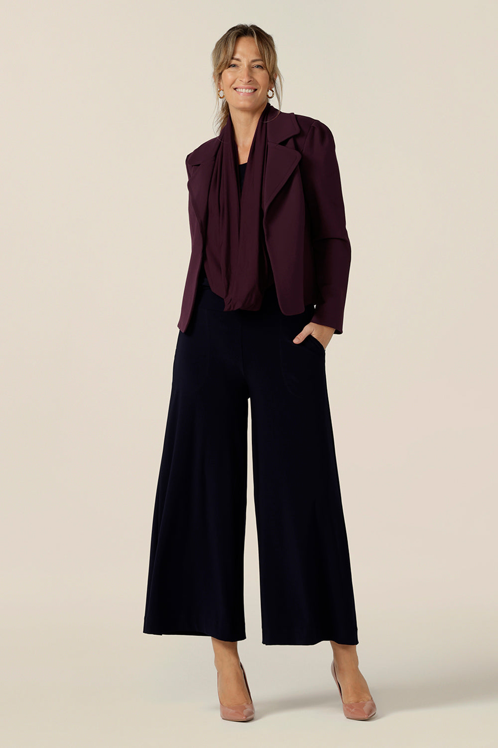 Model wears the Garcia Jacket in Mulberry ponte fabric by Australian and New Zealand women's clothing brand, L&F. Featuring collar and notch lapels and long sleeves, this open-fronted jacket is good for corporate wear and casual wear.