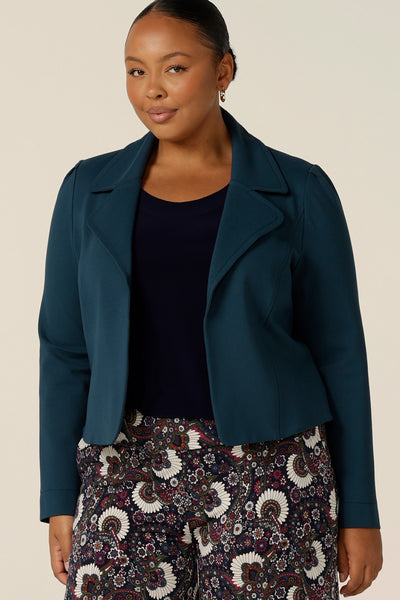 Model wears the Garcia Jacket in Petrol ponte fabric by Australian and New Zealand women's clothing brand, L&F. Featuring collar and notch lapels and long sleeves, this open-fronted jacket is good for corporate wear and casual wear.