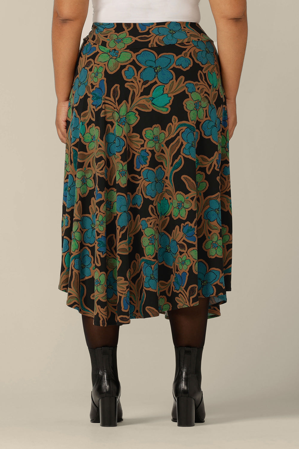 Back view of an asymmetric, midi skirt in floral print jersey, size 18 by Australian and New Zealand womenswear label, L&F. Australian-made, buy this jersey skirt in sizes 8 to 24.