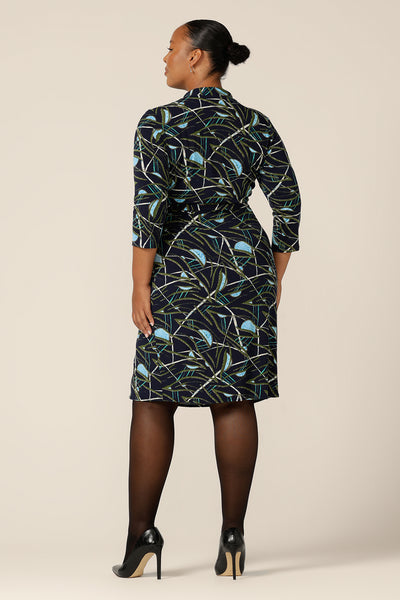 Back view of a size 18 woman wearing the Jett Wrap Dress by L&F. Made by Australia and New Zealand's wrap dress experts, L&F this printed jersey wrap dress is a great dress for workwear. Shop wrap dresses Australia and New Zealand-wide in sizes 8 to 24.