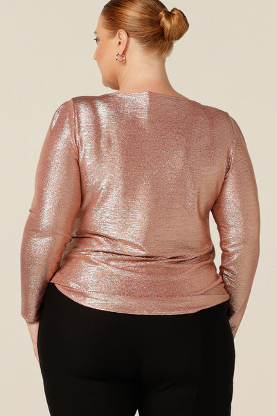 Back view of a great sparkly top for evening and occasion wear, the Jody Top is a shimmering pink jersey top with high scoop neck and long sleeves.  Made in Australia by Australian and New Zealand women's fashion label, L&F, this evening top pairs well with skirts and pants for a cocktail party outfit that sparkles!