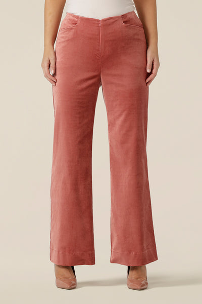 Evening and cocktail wear for women gets a touch of disco fever with these flared leg, tailored pants in musk pink velveteen. Made in Australia by Australian and New Zealand women's clothing label, L&F, these special event pants are available to shop in sizes 8 to 24, petite to plus sizes.