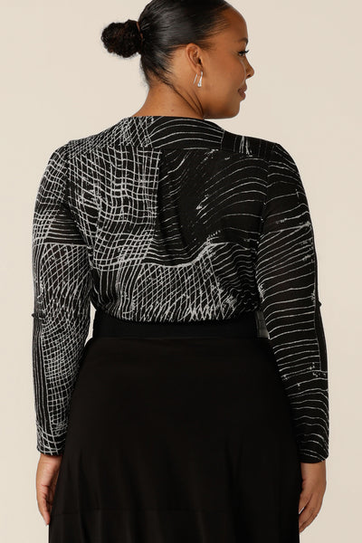 Back view of a long sleeve, round neck top with abstract black and white pattern, size 18, this is the Leith Top by Australian and New Zealand women's clothing label, L&F. A good top for work wear, tailored details enhance this comfortable top's stretchy, textured knit fabric.