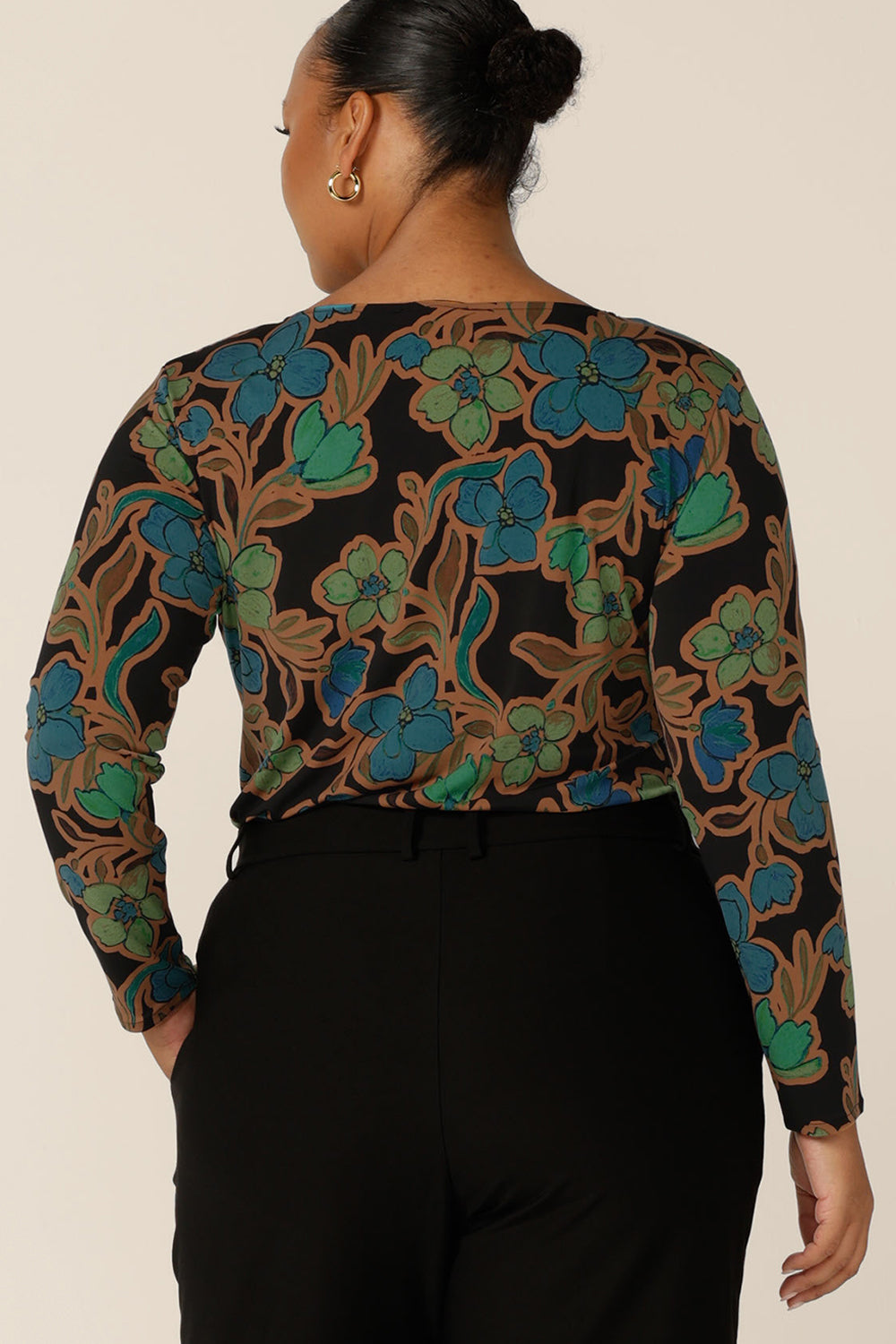 Back view of a fuller figure, size 18 woman wearing a boat neck jersey top with long sleeves. In an opulent floral print, this slim-fit jersey top is made in Australia by Australian and New Zealand, size inclusive women's clothing brand, L&F.