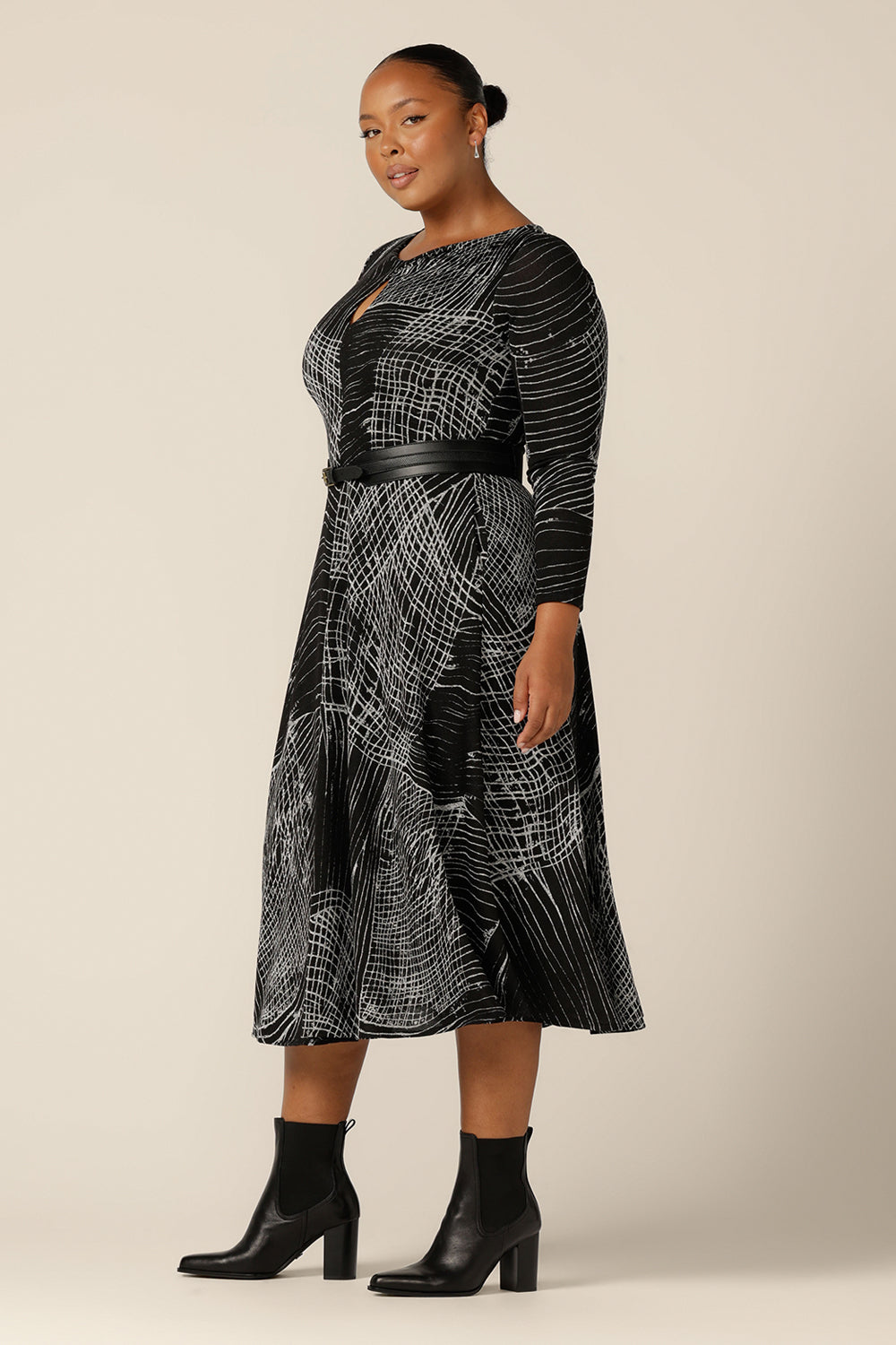 A good dress for plus size, fuller figure women, the Sandee Dress by Australian and New Zealand women's clothing company L&F is well-fitting in a stretch knit fabric. A midi length, long sleeve dress with twisted keyhole detail, this is an Australian-made dress available to buy in an inclusive size range of 8 to 24.