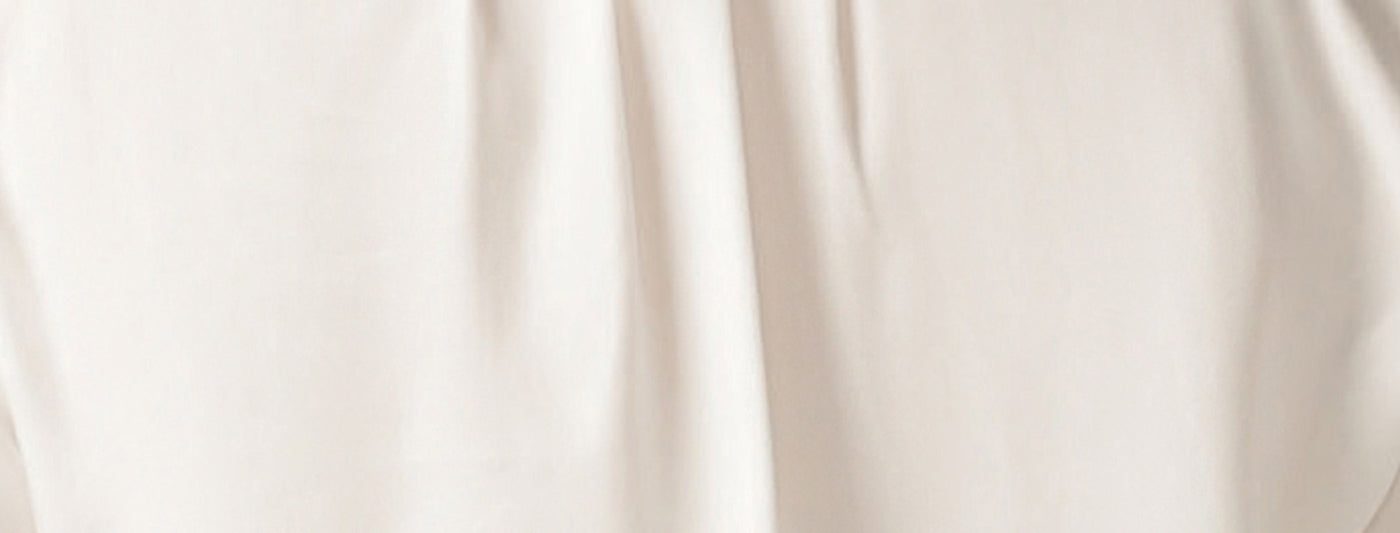 Image of white Tencel fabric, an eco-conscious, sustainable fabric used by Australian-made clothing brand Leina and Fleur for work shirts and work wear pants and jackets for petite to plus size women.