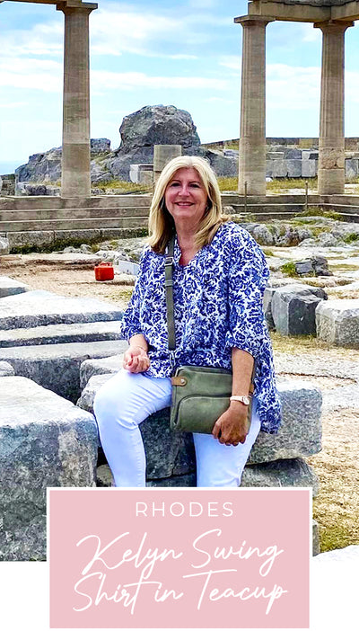 Loyal customer of Australian and New Zealand women's clothing label, elarroyoenterprises, Susan wears a blue and white patterned, lightweight, Australian-made shirt in Greece, as part of her guide for over-40s women on what clothes to pack for your travel holiday.