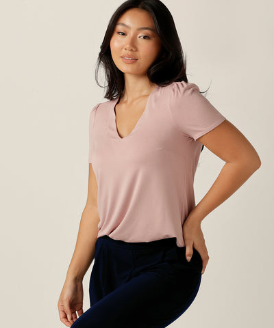 tailored short sleeve top with v-neckline and shirttail hemline