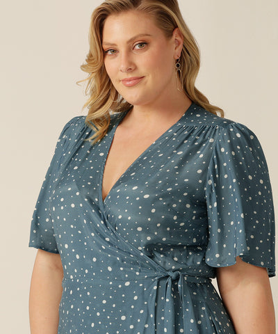 tailored wrap dress with pockets made from breathable fabric.