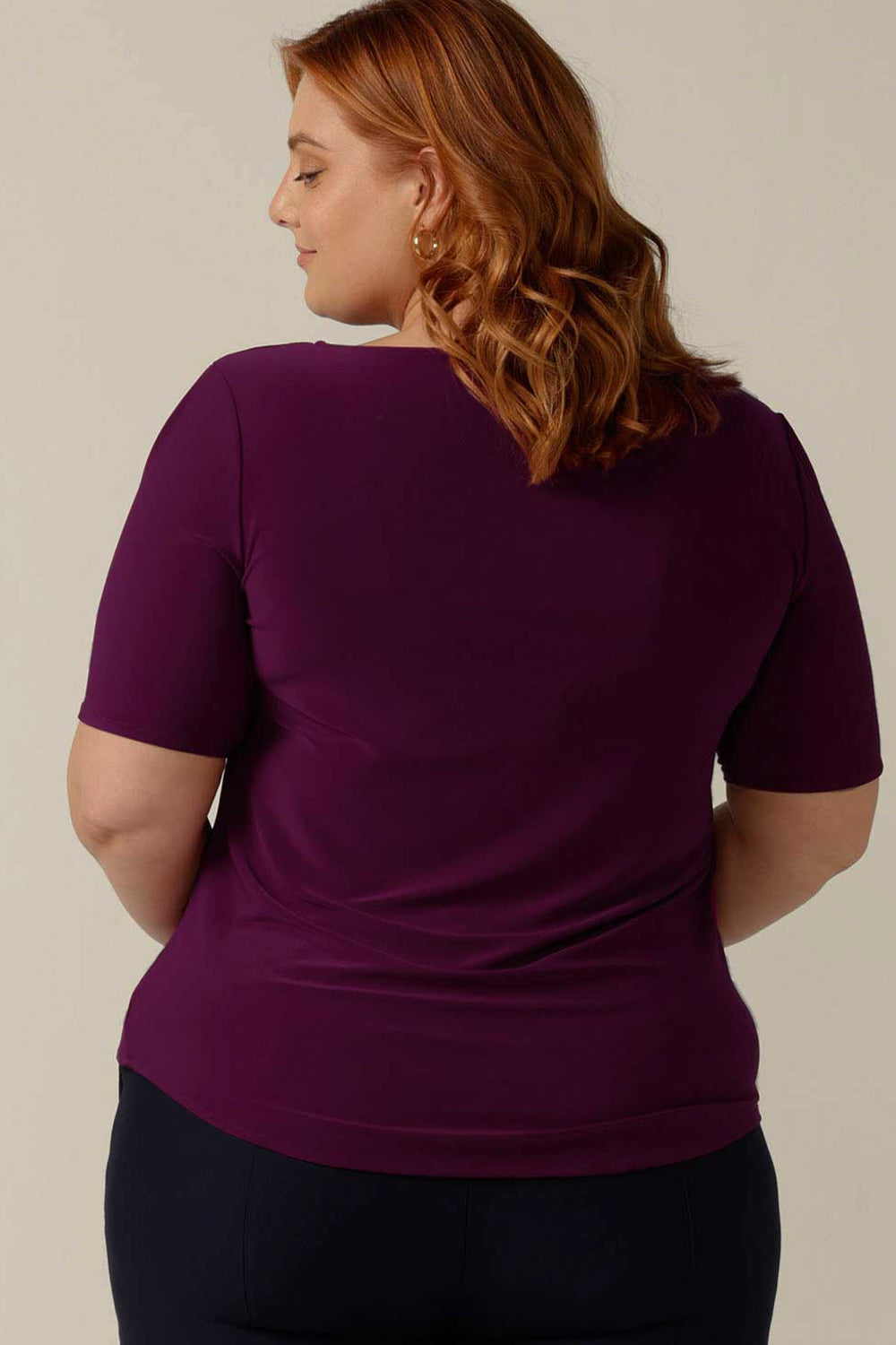 simple line, softly tailored magenta jersey top with boat neckline and short sleeves