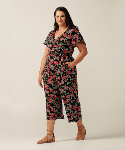Wrap-front stretch jersey jumpsuit with short flutter sleeves and wide cropped legs. Featuring an exclusive colourful floral print, this jumpsuit is made in Australia for plus size women, petite women and women looking to build a capsule wardrobe.