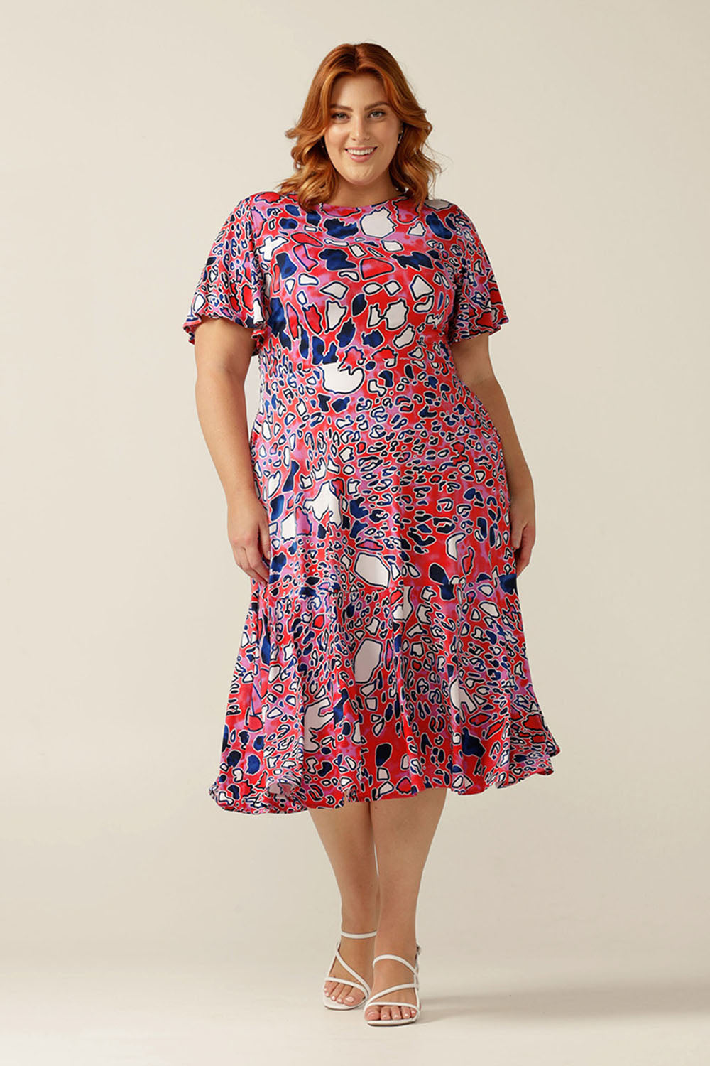 fixed wrap jersey dress with flutter sleeves, pockets and ruffle on skirt.