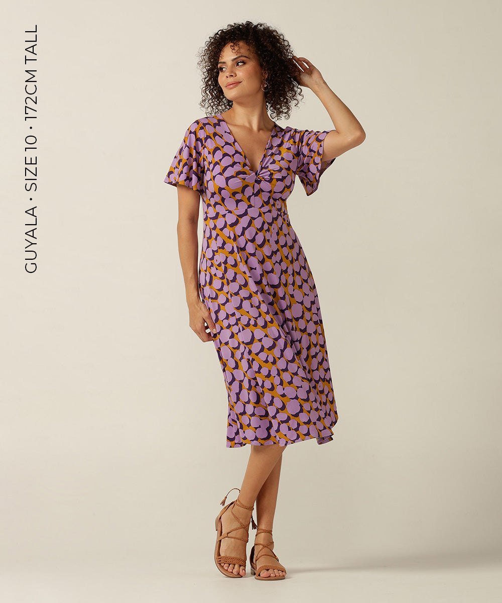 twist front, empire line short dress with flutter sleeve. Made in Australia for plus size women, petite sizes and women looking for evening, occasionwear and party dresses.