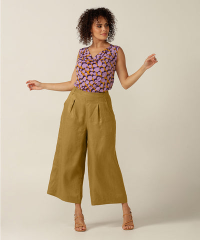100% linen sailor front, wide legged pant with tailoring details.