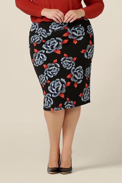 A great skirt for work and corporate wear, the Andi Skirt in Ikebana is a below-the-knee length tube skirt in stretch jersey fabric. A black skirt with blue and orange floral pattern, this modern print matches well with black and navy tops and jackets. Shop this skirt in an inclusive size range of 8-24. 