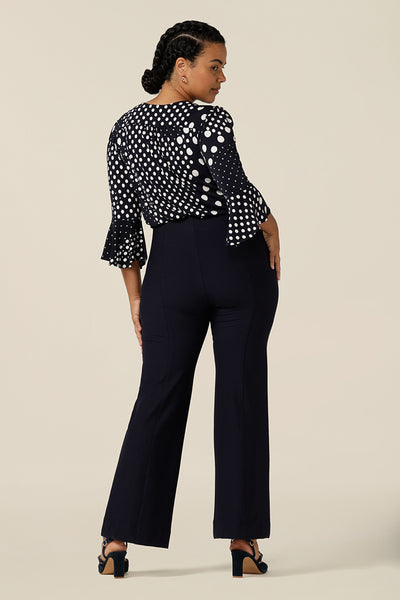 Good for workwear or evening wear pants, these navy trouser by Australia and New Zealand women's fashion label, L&F feature full-length, boot-cut flared legs. Worn with a navy and white print top for elegant corporate style. 