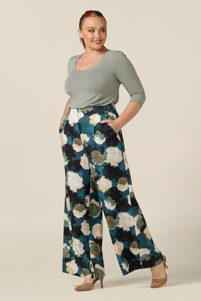 Wide-leg, high-waisted smart printed pants are worn by a size 12, curvy woman. Part of Australian and New Zealand women's clothing label, L&F's focus on sustainable fashion, these work wear trousers are eco-conscious in Tencel fabric. Worn with a round neck bamboo jersey top, the pants look smart-casual for workwear and beyond!