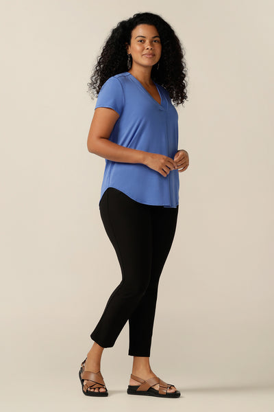 A curvy size 12 woman wears a short-sleeved V-neck top in bamboo jersey. Lightweight, breathable and made from natural fibres, bamboo jersey makes for a comfortable and cool jersey top. Made from sustainable fibres and Australian-made, this women's bamboo jersey top highlights 2 way L&F clothing is working towards producing more eco-conscious, sustainable fashion