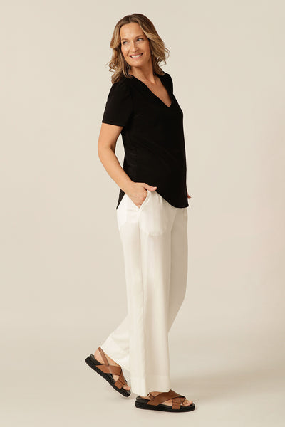 tailored short sleeve top with v-neckline and shirttail hemline