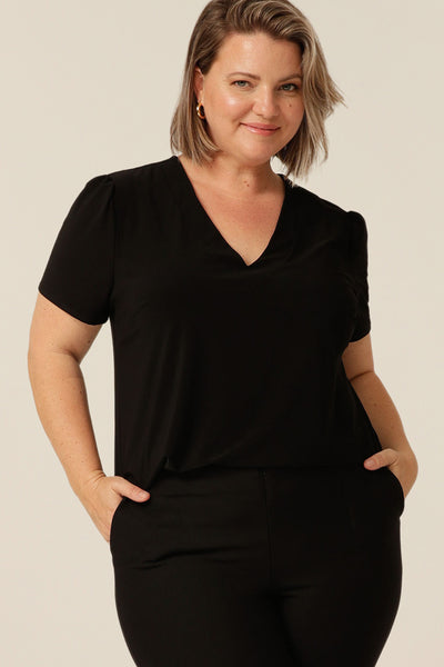 tailored short sleeve top with v-neckline and shirttail hemline