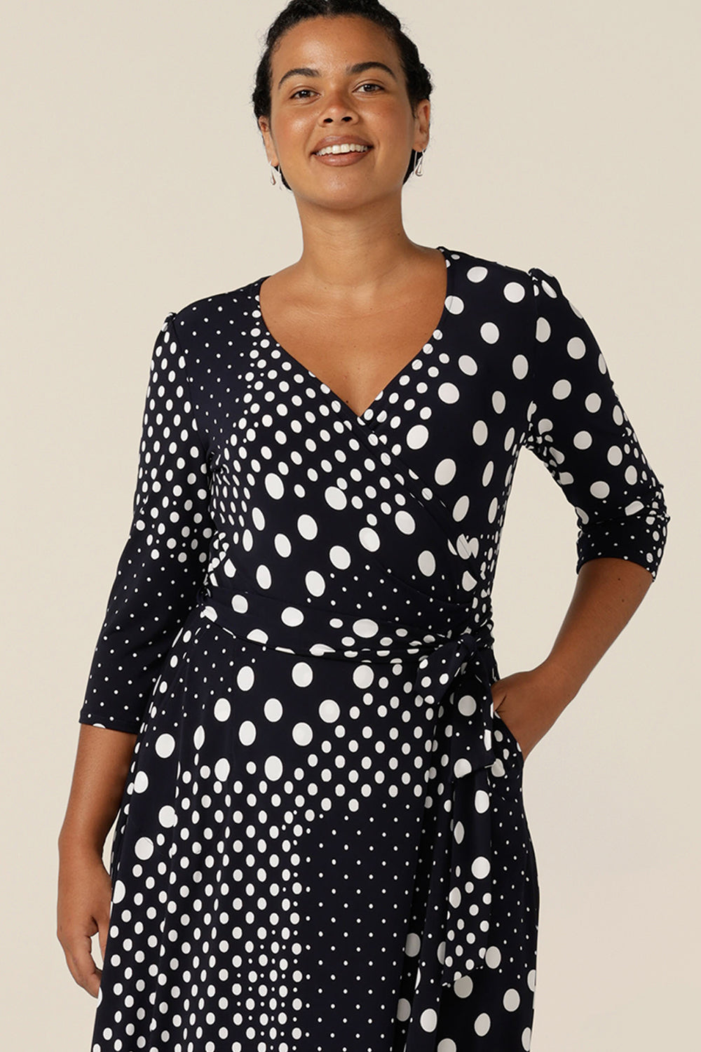 A jersey wrap dress with navy and white spot print, this is a great workwear dress. Featuring 3/4 sleeves and a full, midi length skirt, this wrap dress was made in Australia by Australian and New Zealand women's clothing label L&F. 