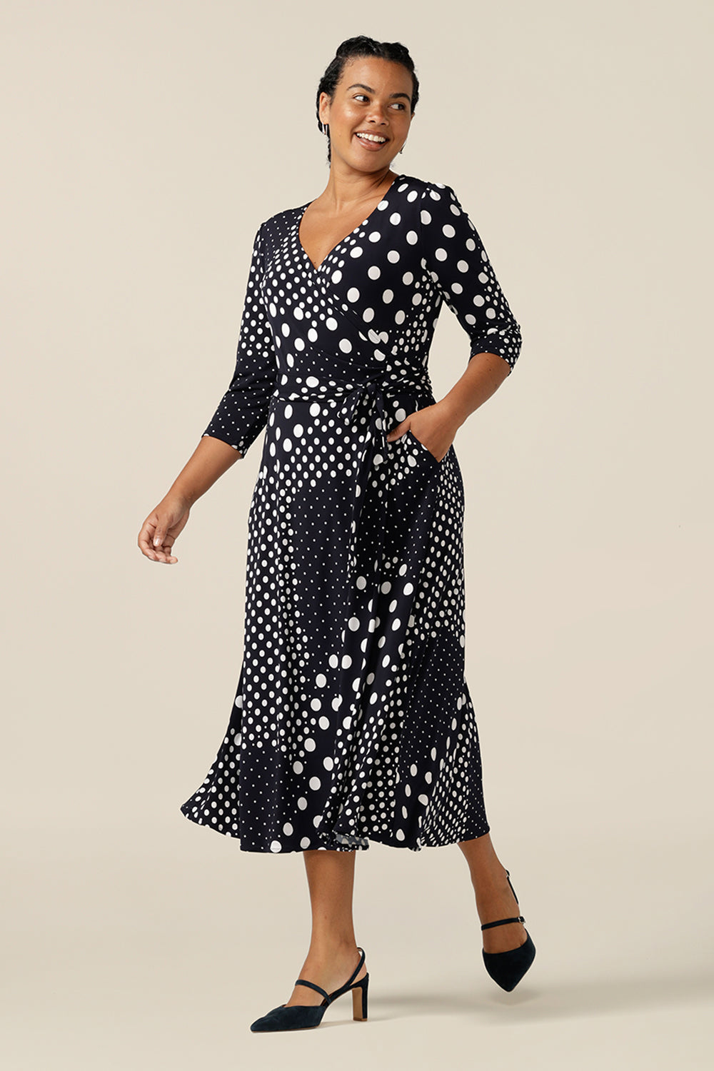 A jersey wrap dress with navy and white polka dot print, this is a great crossover workwear dress. Featuring 3/4 sleeves and a full, midi length skirt, this wrap dress was made in Australia by Australian and New Zealand women's fashion brand L&F.