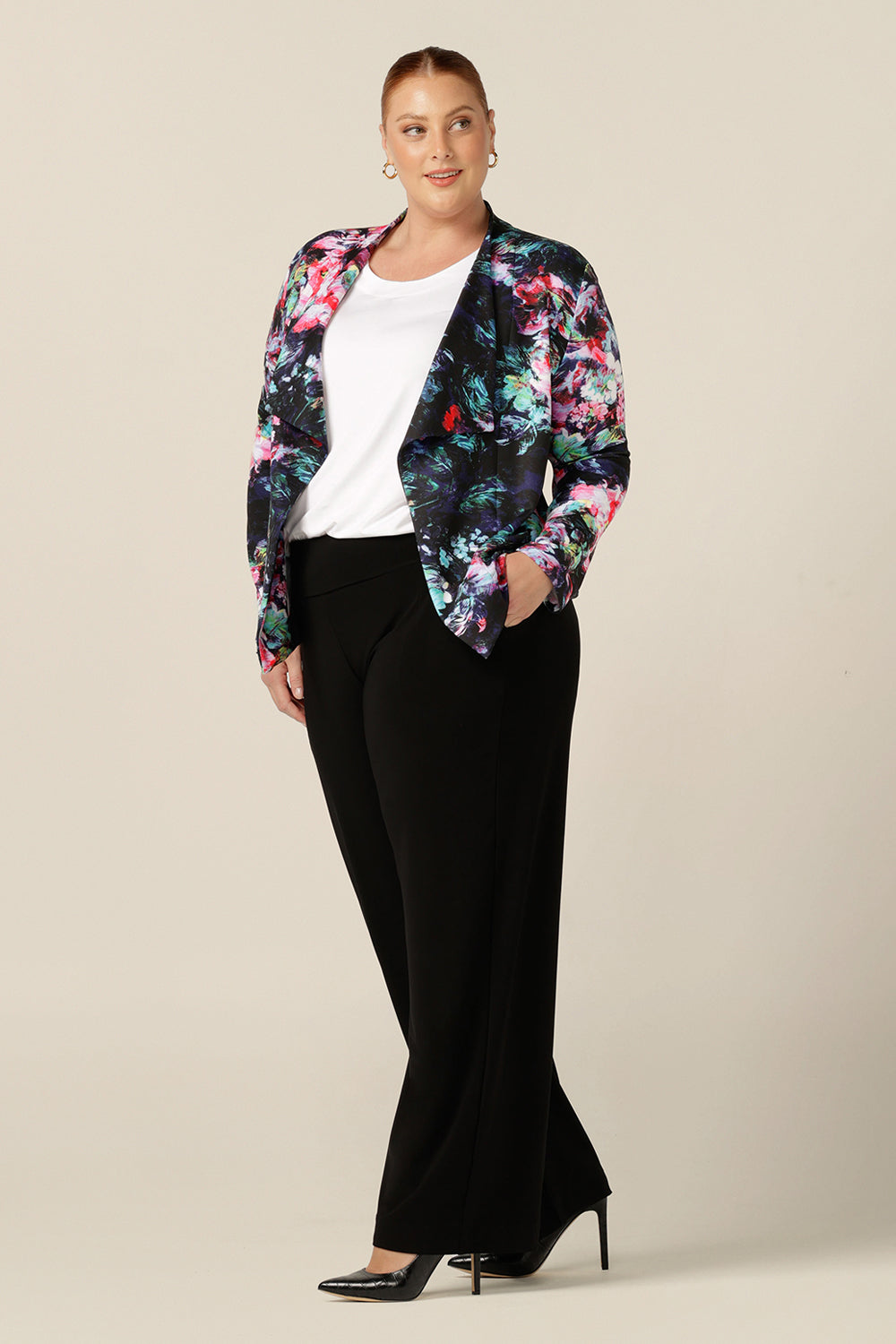 Made in Australia, this is an abstract, floral print jacket on a black scuba base. Worn with black straight leg pants and a white top in bamboo jersey, this jacket creates easy elegant workwear or smart-casual weekend wear. Shop with free shipping to new Zealand.