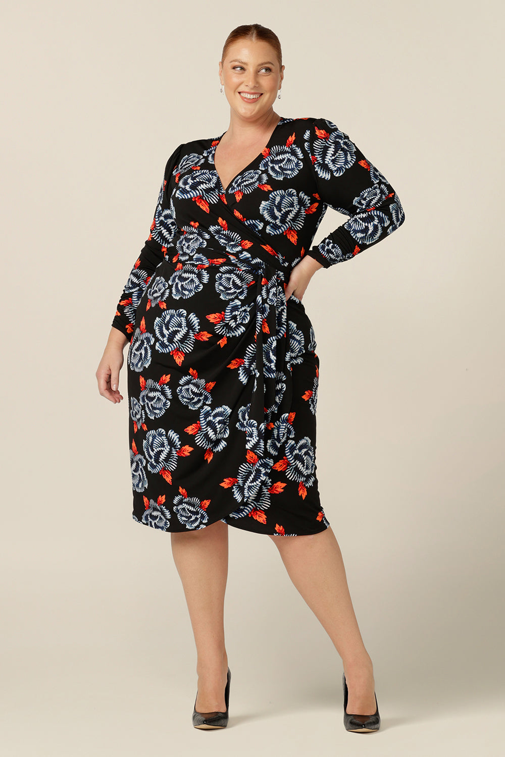 A long sleeve wrap dress with tulip skirt by Australian and New Zealand women's clothing label, L&F. Worn by a fuller figure woman, this jersey wrap dress is available in inclusive sizes, 8 to 24. 
