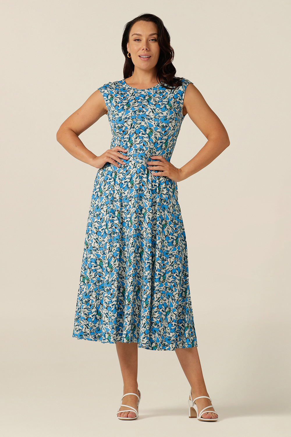 high-neck sleeveless jersey dress with calf-length full skirt and pockets