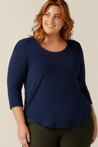 a size 18 woman wears a french navy bamboo jersey top with a round neckline and 3/4 sleeves. Made in Australia in sustainable bamboo jersey, this casual women's top is lightweight, breathable and comfortable.