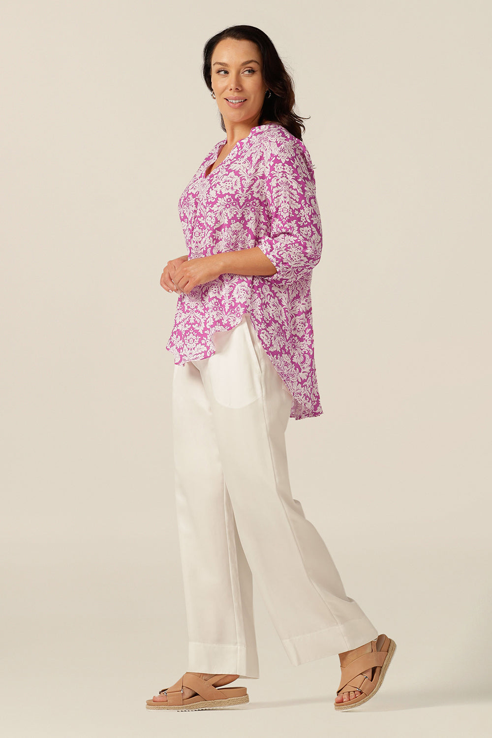 the Kelyn swing shirt features a V-neckline with crossover back neck detail, voluminous back pleats and 3/4 sleeves with tailored tucks. 