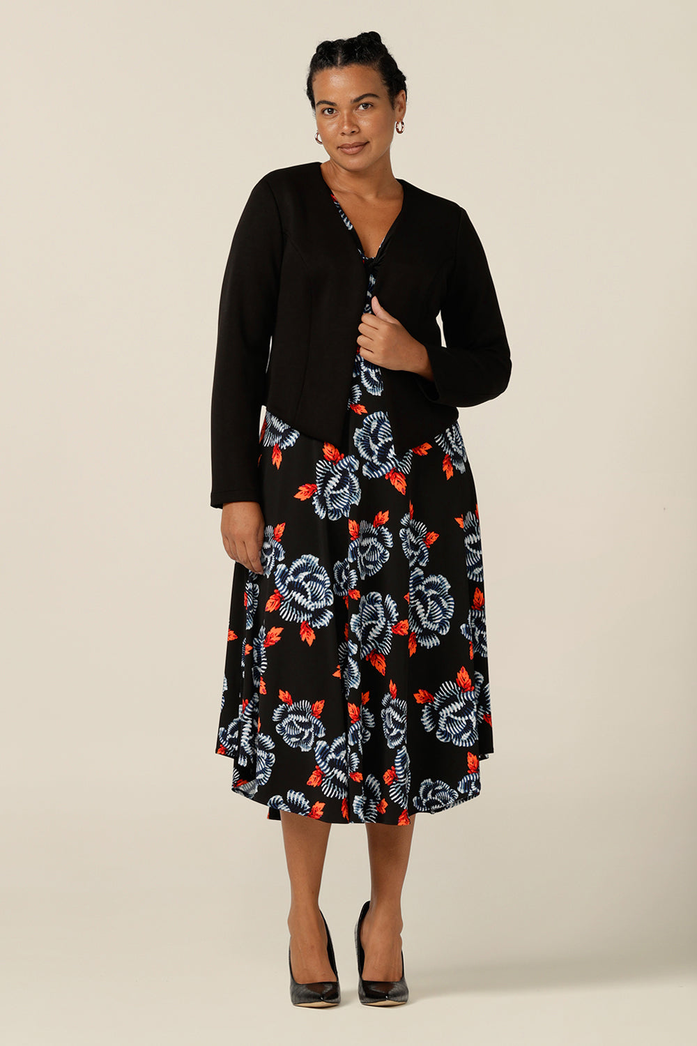 Wear it for work - a 3/4 sleeve, empire line dress in black-base floral print jersey is worn under a black soft tailoring jacket. shop L&F work dresses and jackets in sizes 8 to size 24.