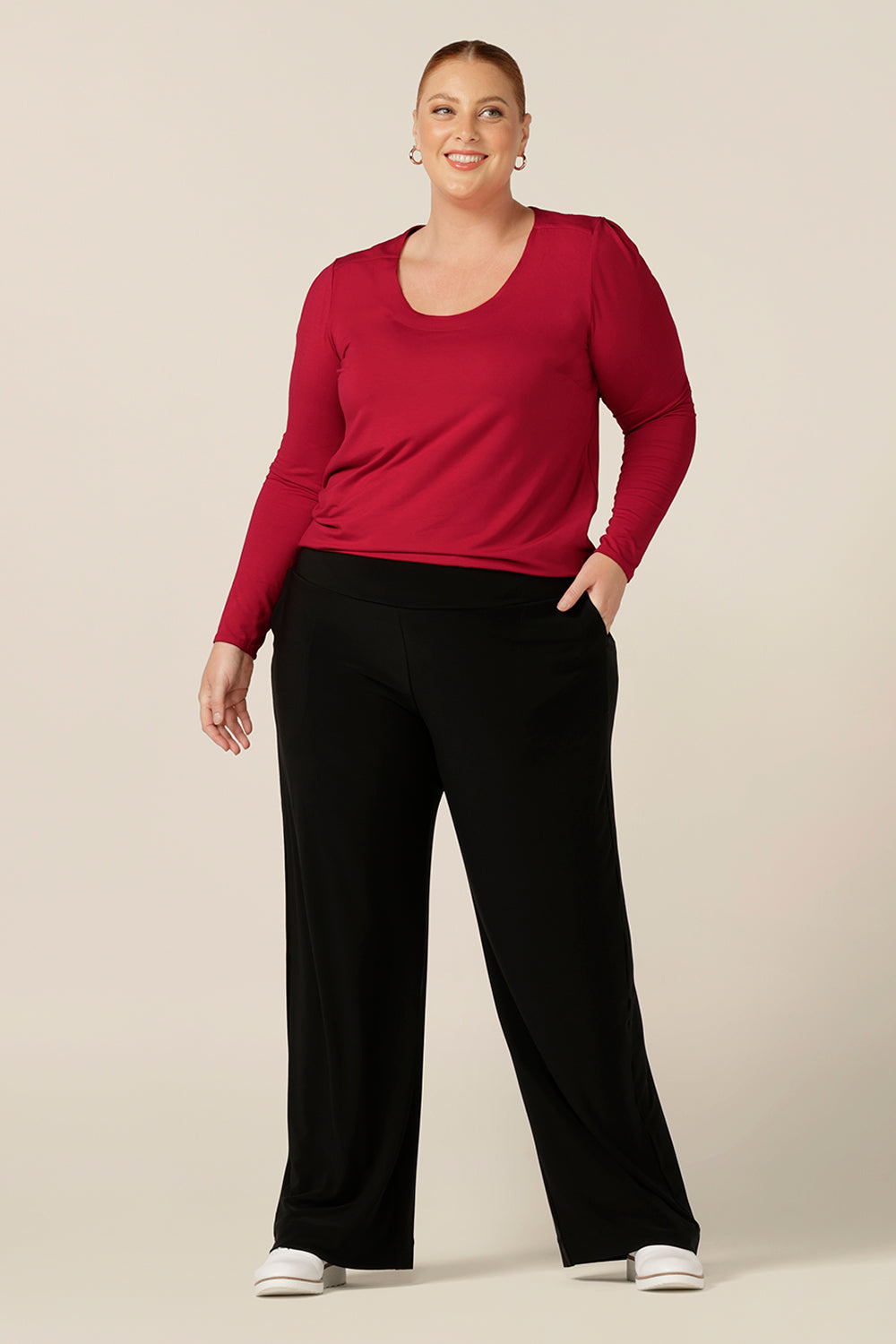 A round neck, long sleeve top for plus size and fuller figure women. Worn with wide leg black pants, this casual top is styled for weekend wear. In red bamboo jersey, this comfortable top is made in Australia in an inclusive 8-24 size range.