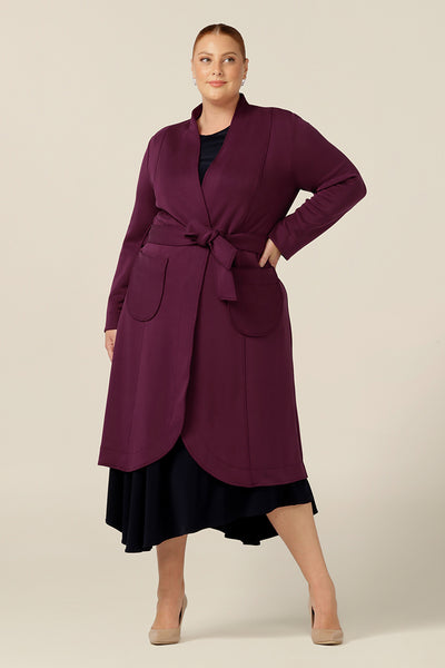 A good lightweight coat for travel, this softly tailored trenchcoat by Australia and New Zealand fashion brand, L&F is made in winter-weight, wine red modal to shape comfortable coat for petite to plus size women.