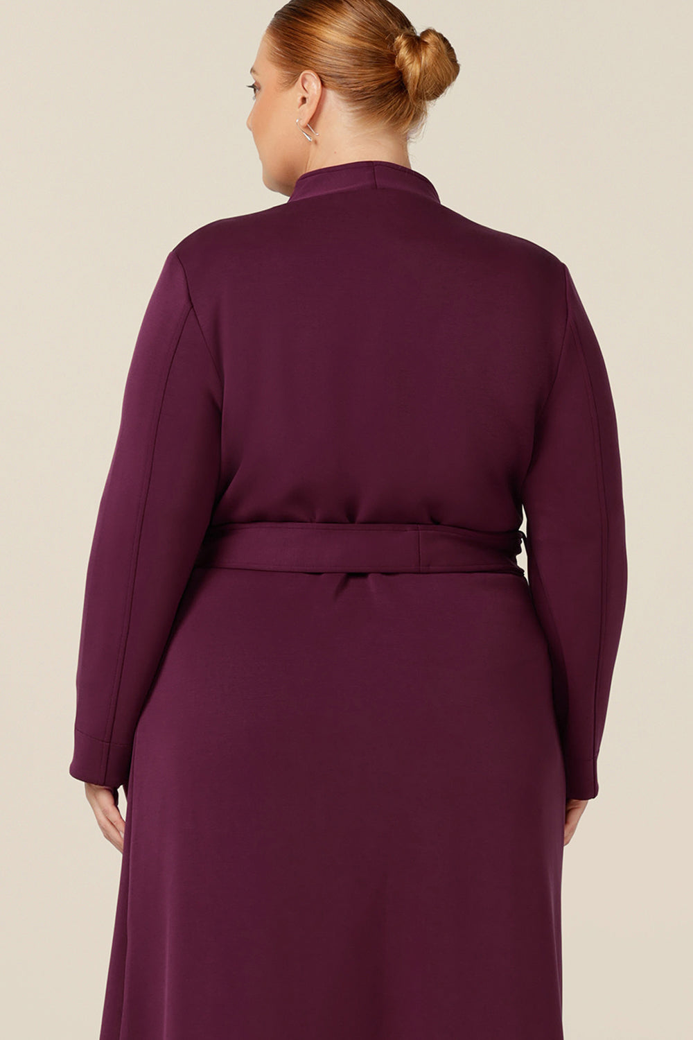 Back view of Australia and New Zealand women's clothing label, L&F's best lightweight coat for travel. This soft tailoring trenchcoat is made in winter-weight modal to shape a comfortable coat for petite to plus size women.