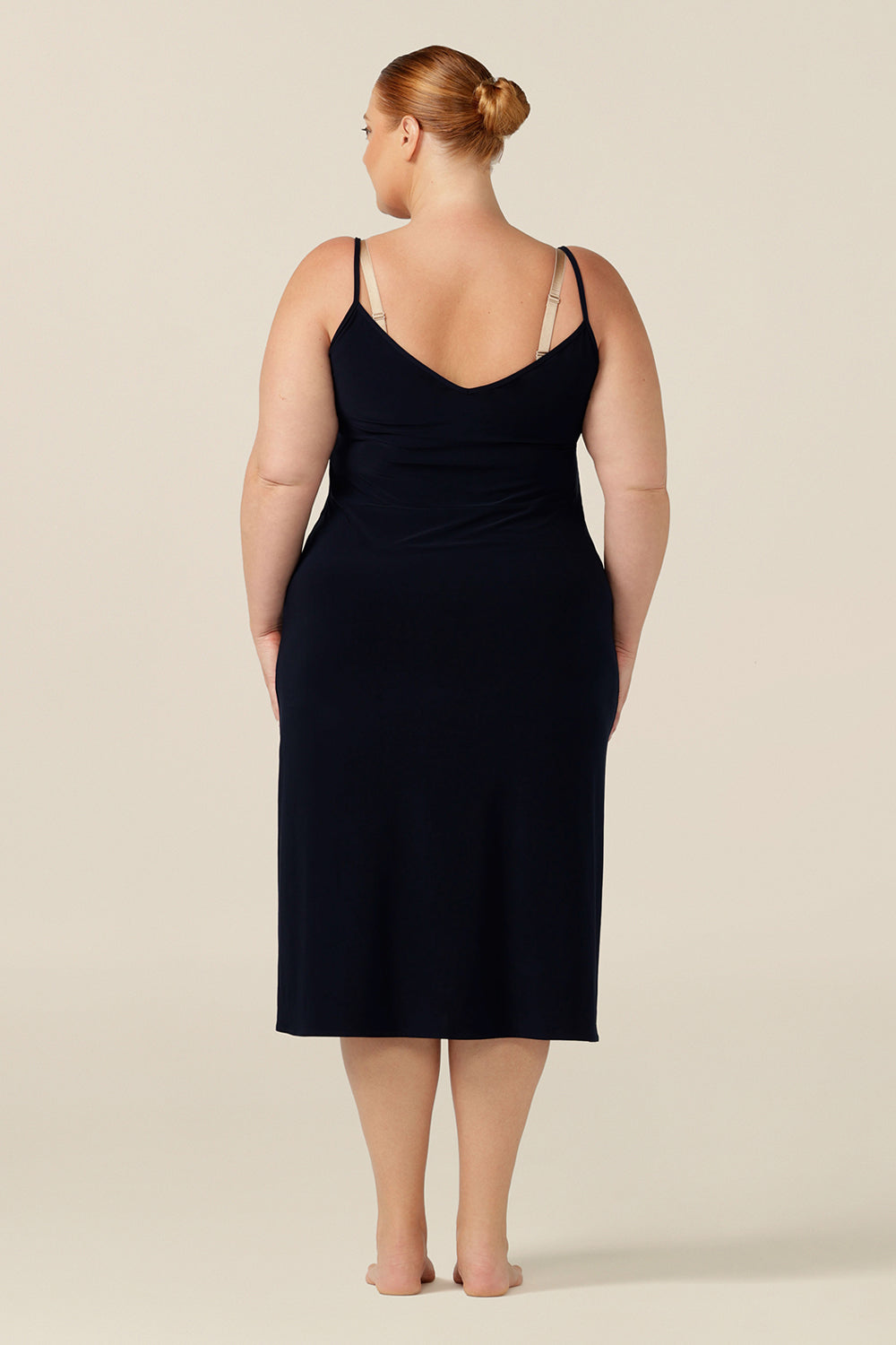 The ultimate smoothing undergarment, this midi-length, reversible, navy jersey slip is made-in-Australia in an inclusive 8 to 24 size range.
