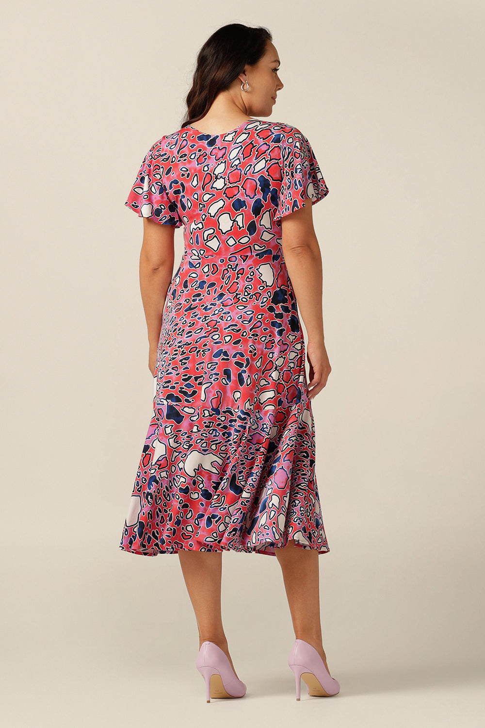 fixed wrap maxi dress with flutter sleeves, pockets and ruffle on skirt.
