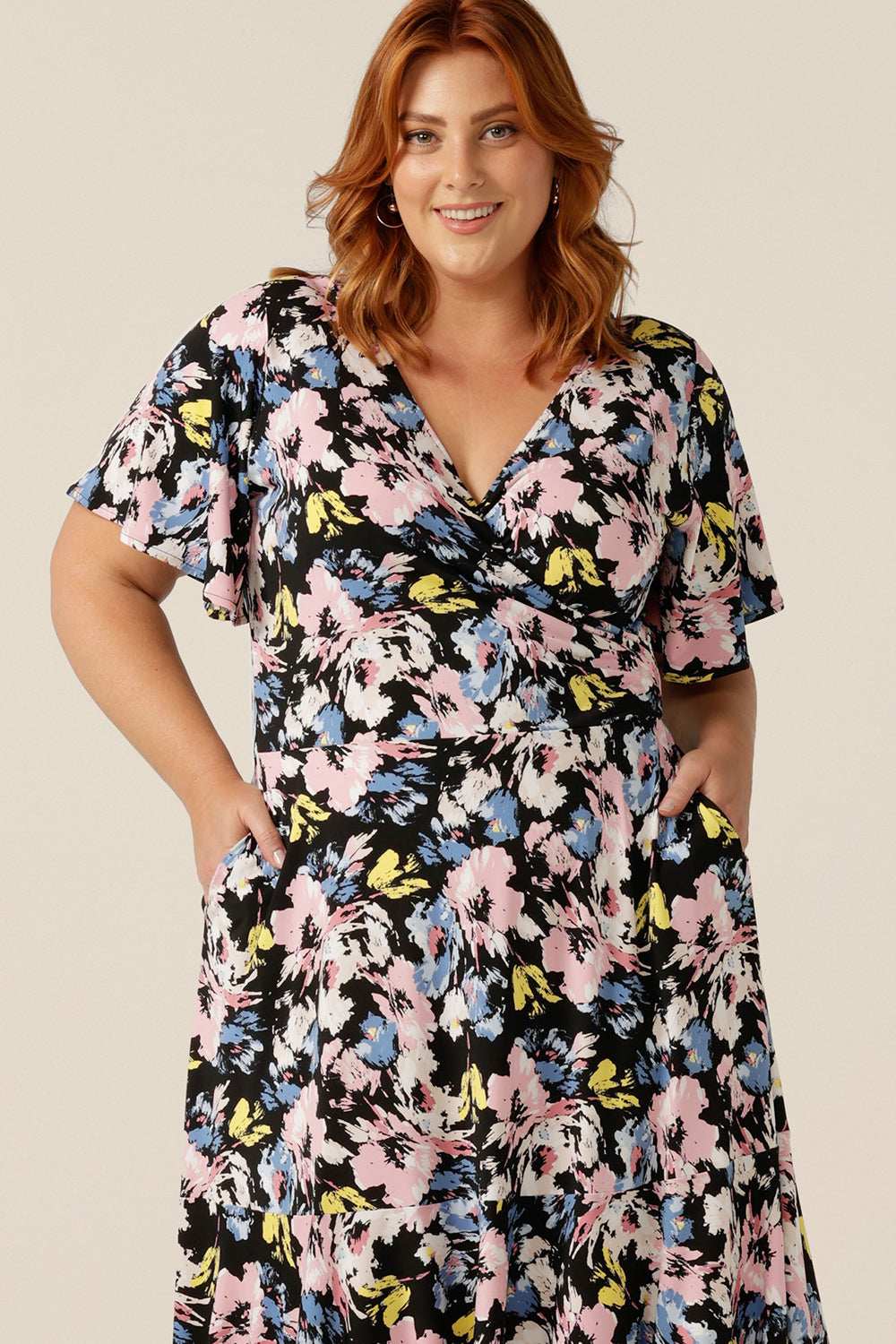 Vintage floral print dresses for women over 40, the Nicolle Reversible Dress has short sleeves and a full knee-length-skirt. A reversible dress, it can be worn as a V-neck wrap dress or backwards with a boat neckline. Well made and well-fitting in sizes 8 to size 24, shop jersey wrap dresses at Leina and Fleur online