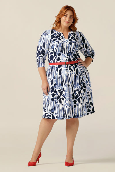 Women of Australia and New Zealand, this Nova Dress is tailored in stretch jersey for a comfortable work wear dress that's easy to wear all day. With 3/4 sleeves, side pockets and V-neck, this dress is a modest business dress for sizes 8 to size 24. This jersey workwear dress is worn with a red belt. 