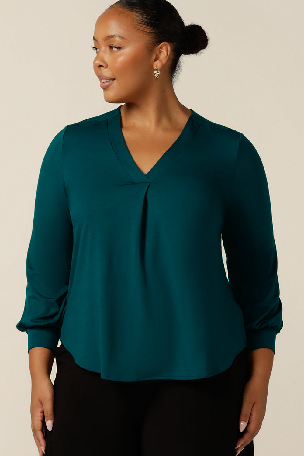A size 18, plus size woman wears a long sleeve, V-neck top in bamboo jersey., this top is good for work and casual wear.