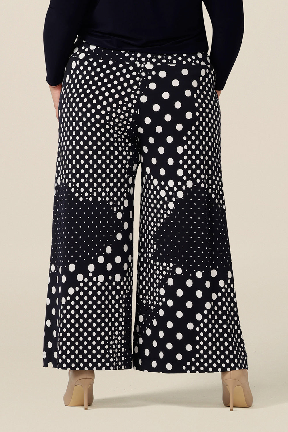 Back view of work and corporate wear pants by Australia and New Zealand fashion label, L&F's wide leg pants in a navy and white spot print. Shop these made-in-australia , stretch jersey trousers online in sizes 8 to 24.