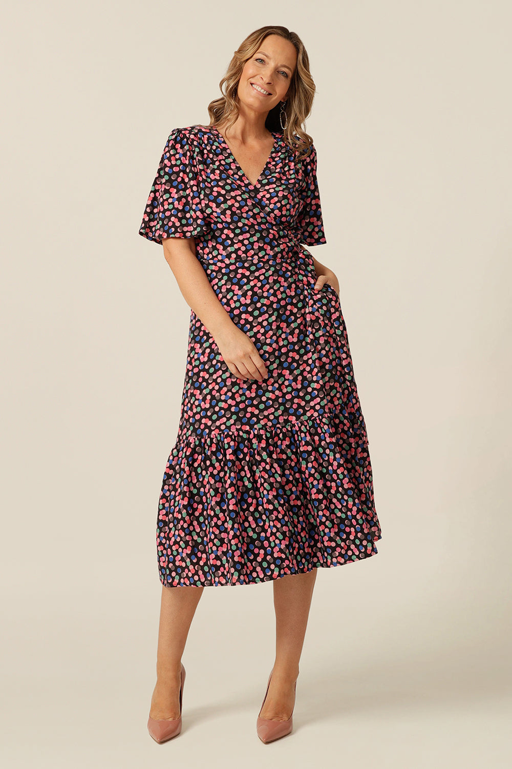 tailored wrap dress with flutter sleeves and  pockets made from breathable fabric. Made in Australia for petite to plus size women.