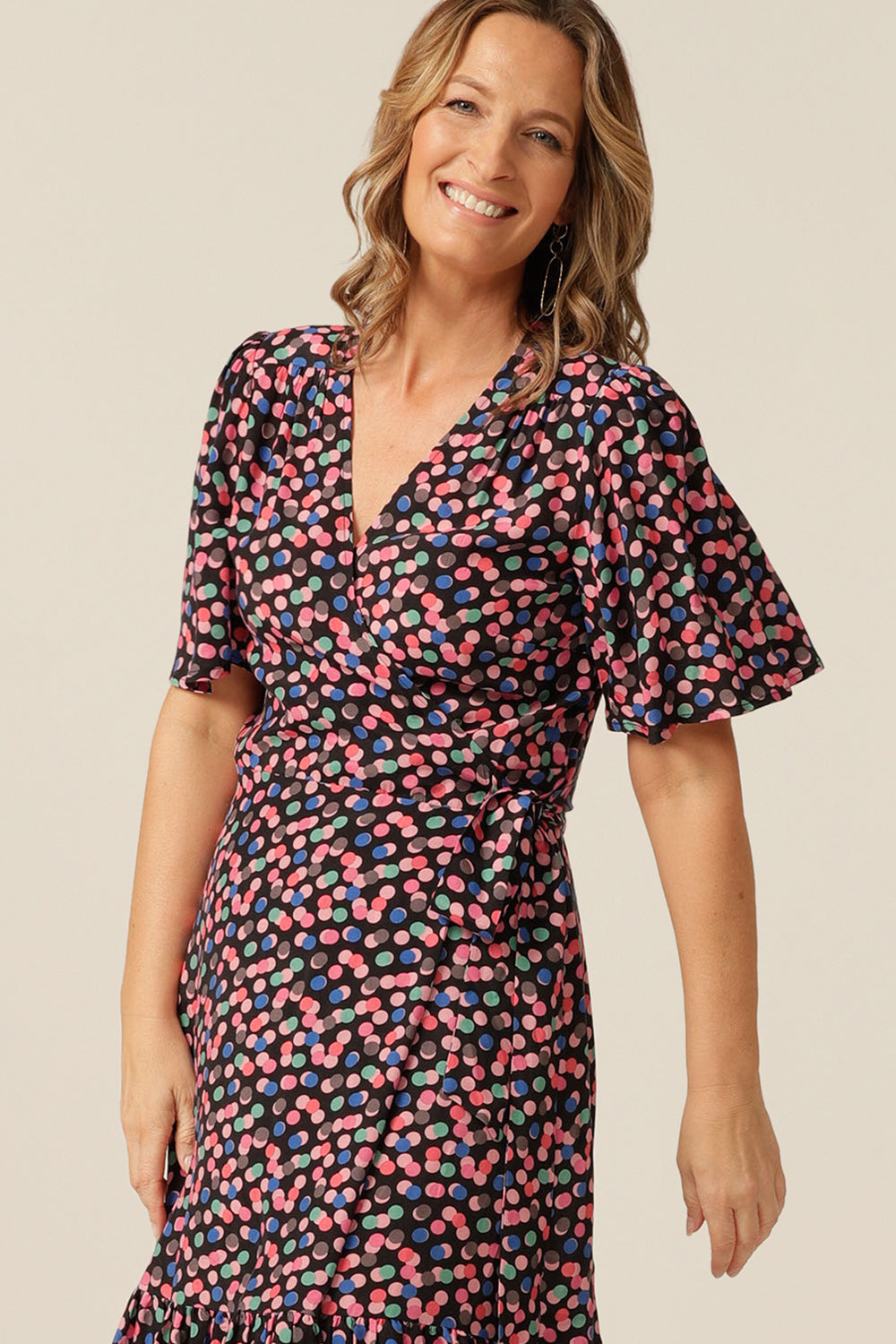 tailored wrap dress with flutter sleeves and  pockets made from breathable fabric. Made in Australia for petite to plus size women.