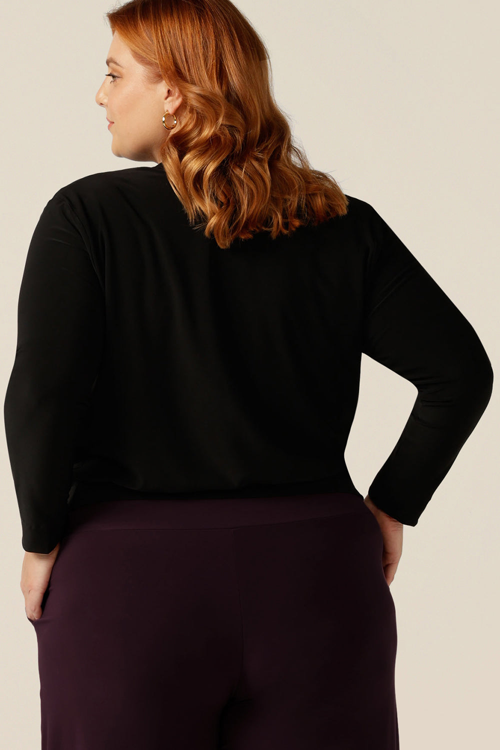 the back view of Australian women's clothing brand, elarroyoenterprises's jacket/cardigan Jacardi. Designed as an autumn/winter jacket, this cover-up is warm with long sleeves and heavy weight jersey fabric, which adds to this jacket's comfortable fit for workwear and casual layering