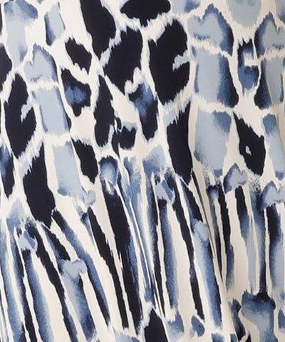 Up close image of the blue and white pattern on the L&F jersey jumpsuit with flutter sleeves, wrap bodice and cropped length. Made in Australia for petite to plus size women. 