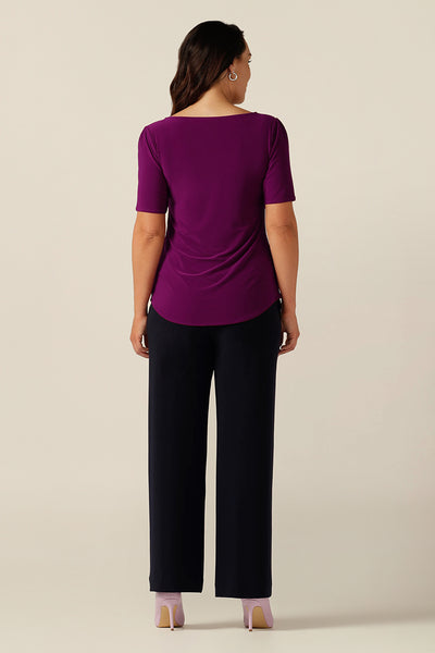 simple line, softly tailored magenta jersey top with boat neckline and short sleeves