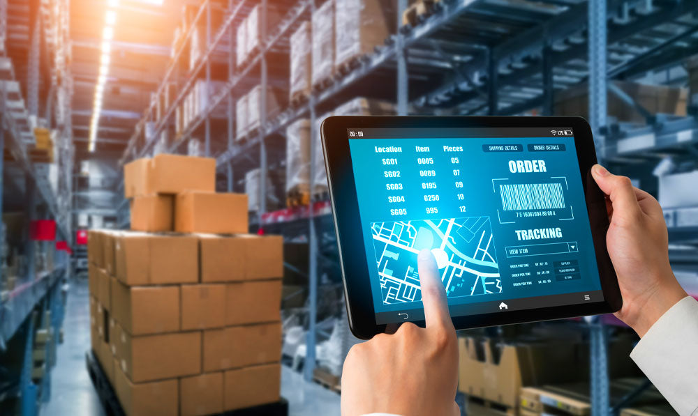 Person taking inventory through a warehouse on a tablet