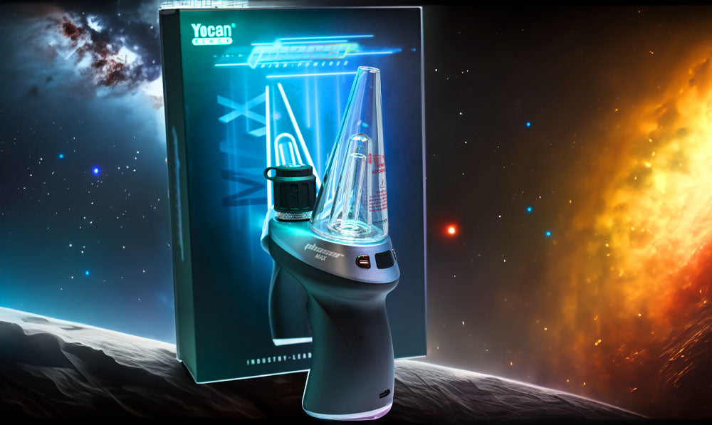 Yocan Black Phaser Max standing with packaging in front of solar system